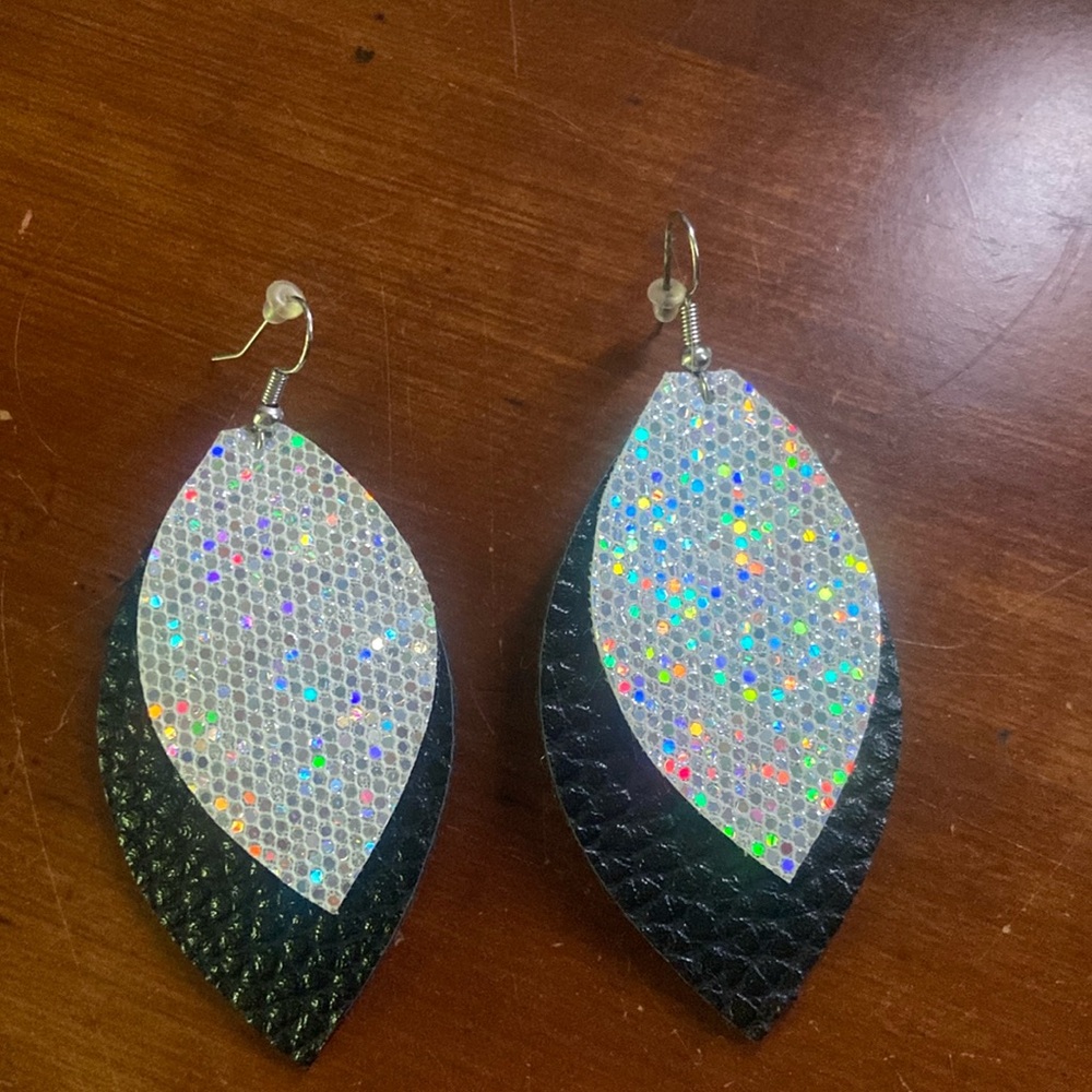 Leather earring black and sparkly silver. Never worn. Great condition.